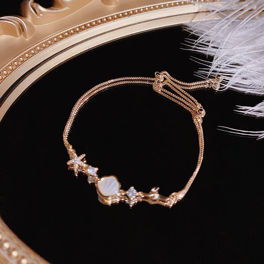 Gold starfish and shell bracelet